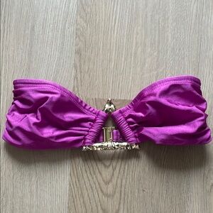 Meshki Purple bandeau swim too with an elegant metal detail.